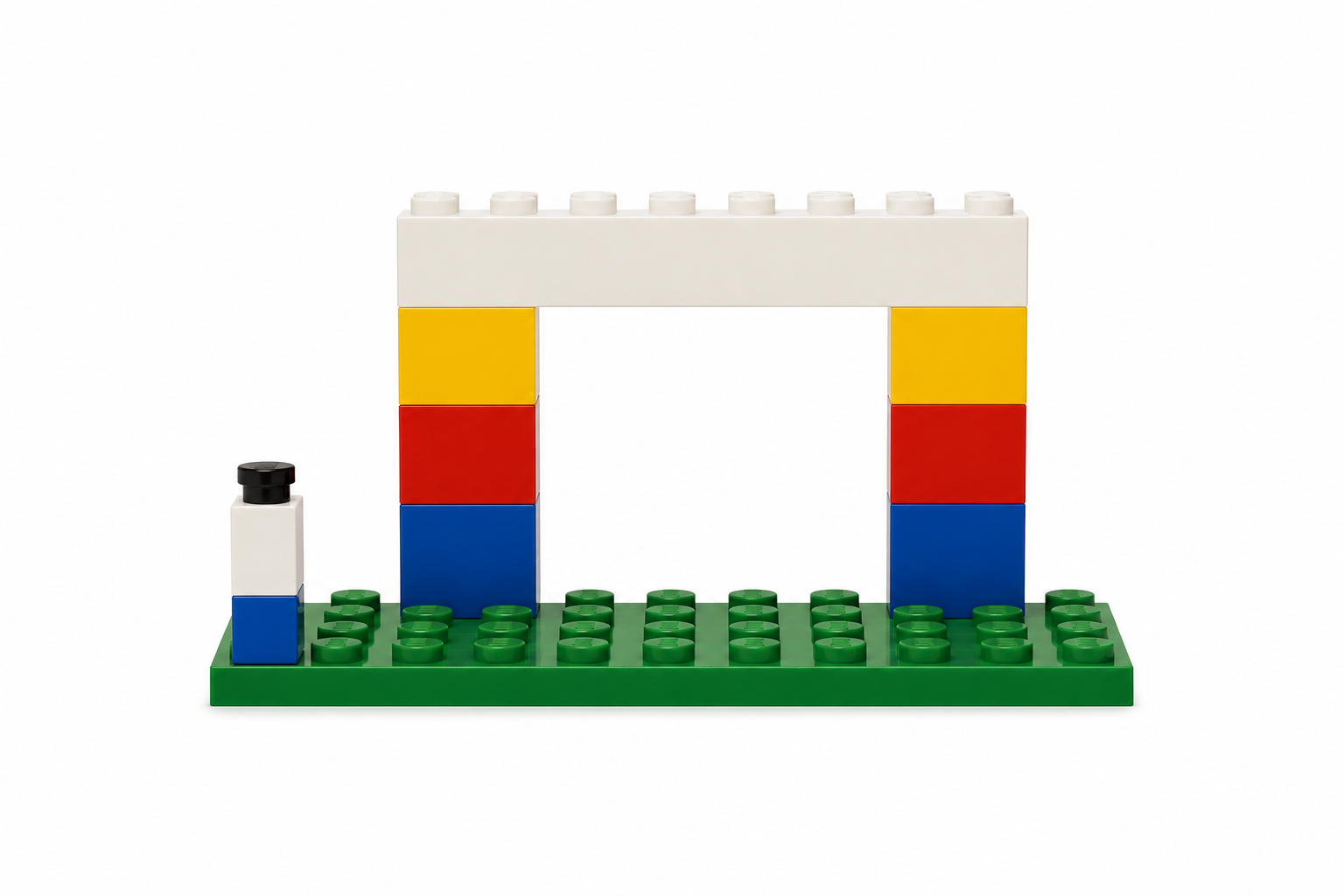 LEGO entrance arch with blue, red, and yellow pillars on a green baseplate