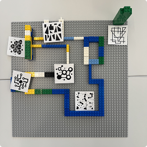 Top-down view of a second landmark-based LEGO layout with AR marker cards